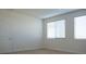 Bedroom with neutral carpet, white walls, and two windows with white blinds at 832 Gallery Course Dr, Las Vegas, NV 89148