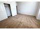 Bright bedroom features neutral carpet, closet with sliding doors, and white walls at 832 Gallery Course Dr, Las Vegas, NV 89148