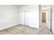 This bedroom features carpeted floors, white walls, and a closet with sliding doors at 832 Gallery Course Dr, Las Vegas, NV 89148