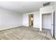 Spacious primary bedroom with plush carpet and ensuite access offers a luxurious layout at 832 Gallery Course Dr, Las Vegas, NV 89148