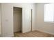 Bedroom with closet and window featuring carpet, white walls and trim at 832 Gallery Course Dr, Las Vegas, NV 89148