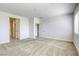 Large bedroom with plush carpet and ensuite access provides a bright and open retreat at 832 Gallery Course Dr, Las Vegas, NV 89148