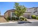 Charming single-story house with a two-car garage, desert landscaping, and a gated side yard at 832 Gallery Course Dr, Las Vegas, NV 89148