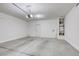 Spacious two car garage with concrete floors, a water heater, and an automatic garage door opener at 832 Gallery Course Dr, Las Vegas, NV 89148