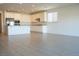 Spacious kitchen with white cabinets, stainless steel appliances, and tile floors with ample counter space at 832 Gallery Course Dr, Las Vegas, NV 89148