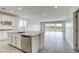 Open concept kitchen with an island, stainless steel appliances, and views of the backyard at 832 Gallery Course Dr, Las Vegas, NV 89148