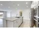 Bright kitchen with stainless steel appliances, white cabinets, and granite countertops offers modern elegance at 832 Gallery Course Dr, Las Vegas, NV 89148