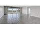 Open-concept living room with tile flooring and sliding glass doors to backyard offers great space at 832 Gallery Course Dr, Las Vegas, NV 89148