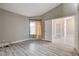 This bedroom features a vaulted ceiling and light wood-look floors at 8517 Soneto Ln, Las Vegas, NV 89117