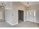 Bright entryway with modern floors, vaulted ceiling, and large windows at 8517 Soneto Ln, Las Vegas, NV 89117