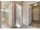 Hallway featuring multiple doors and views into other rooms at 8517 Soneto Ln, Las Vegas, NV 89117