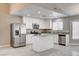 Modern kitchen with stainless steel appliances, granite countertops, and an island at 8517 Soneto Ln, Las Vegas, NV 89117