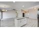 Modern kitchen with white cabinetry, stainless steel appliances, and a granite topped center island at 8517 Soneto Ln, Las Vegas, NV 89117