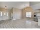 Spacious living room with modern floors, vaulted ceilings, and large windows at 8517 Soneto Ln, Las Vegas, NV 89117