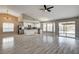 Spacious living room with modern floors, vaulted ceiling, and an open floorplan at 8517 Soneto Ln, Las Vegas, NV 89117