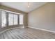 This living room features a large window and light wood-look floors at 8517 Soneto Ln, Las Vegas, NV 89117