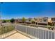 Charming homes line the street as seen from a private balcony with light-colored railing at 9130 Beauchamp Ave, Las Vegas, NV 89148