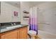 Cozy bathroom with a shower-tub combination and granite countertop at 9130 Beauchamp Ave, Las Vegas, NV 89148