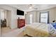 Bright main bedroom with a ceiling fan, walk-out balcony, and spacious layout at 9130 Beauchamp Ave, Las Vegas, NV 89148