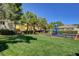 Community playground with mature shade trees and benches overlooking the play area at 9130 Beauchamp Ave, Las Vegas, NV 89148