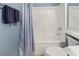 Bathroom featuring bathtub with shower and toilet at 9256 Blue Flax Pl, Las Vegas, NV 89148