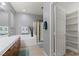 Bright bathroom featuring a shower, tub, and a vanity with wood drawers at 9256 Blue Flax Pl, Las Vegas, NV 89148