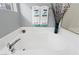 Bright bathroom showcasing soaking tub with chrome hardware and spa-like decorative touches at 9256 Blue Flax Pl, Las Vegas, NV 89148