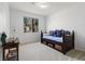 Cozy bedroom with natural light and a decorative daybed with storage at 9256 Blue Flax Pl, Las Vegas, NV 89148