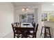 Dining room with a wooden table, chairs, and pendant lighting at 9256 Blue Flax Pl, Las Vegas, NV 89148
