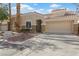 Charming one-story home featuring a low-maintenance yard and attached two-car garage at 9256 Blue Flax Pl, Las Vegas, NV 89148