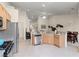 Spacious kitchen features modern appliances, granite counters, and an eat-in dining area at 9256 Blue Flax Pl, Las Vegas, NV 89148