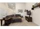 Comfortable living room with sectional sofa, mounted TV, and decorative shelving at 9256 Blue Flax Pl, Las Vegas, NV 89148
