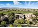 Majestic aerial showcasing property, golf course, and mountain views at 9408 Players Canyon Ct, Las Vegas, NV 89144