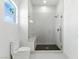 Contemporary bathroom showcasing a frameless glass shower, tile surround and a built-in bench at 9408 Players Canyon Ct, Las Vegas, NV 89144