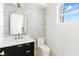Contemporary bathroom with a floating vanity, modern fixtures, and stylish mirror at 9408 Players Canyon Ct, Las Vegas, NV 89144