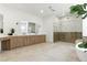 Bright, spacious bathroom with a large shower, soaking tub, dual vanity, and tile floors at 9408 Players Canyon Ct, Las Vegas, NV 89144