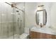 Modern bathroom featuring a glass shower, marble countertops, and stylish fixtures at 9408 Players Canyon Ct, Las Vegas, NV 89144