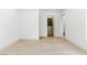 Neutral bedroom featuring light wood floors, walk-in closet and white walls at 9408 Players Canyon Ct, Las Vegas, NV 89144