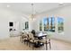 The dining room has modern lighting, view of a pool, and an open concept at 9408 Players Canyon Ct, Las Vegas, NV 89144