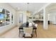 An elegant dining room features modern lighting and an open layout at 9408 Players Canyon Ct, Las Vegas, NV 89144