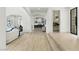 Bright, open entryway features hardwood floors, an archway, and white walls at 9408 Players Canyon Ct, Las Vegas, NV 89144