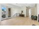 Hallway with light wood flooring and a door to the outside balcony at 9408 Players Canyon Ct, Las Vegas, NV 89144