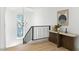Bright hallway with stained glass window and a wooden console table at 9408 Players Canyon Ct, Las Vegas, NV 89144