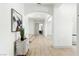 Inviting hallway with archways, elegant decor, and seamless flooring at 9408 Players Canyon Ct, Las Vegas, NV 89144