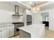 Updated kitchen with a stylish island, stainless steel appliances, and modern lighting at 9408 Players Canyon Ct, Las Vegas, NV 89144