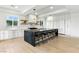 Modern kitchen with a large island, stainless steel appliances, and ample counter space at 9408 Players Canyon Ct, Las Vegas, NV 89144