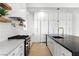 Modern kitchen featuring a large island, updated appliances, and abundant storage at 9408 Players Canyon Ct, Las Vegas, NV 89144