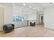 Bright landing area with modern railing, twin chairs, and wood flooring at 9408 Players Canyon Ct, Las Vegas, NV 89144