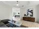 Modern living room with open floor plan, stylish furnishings, and art at 9408 Players Canyon Ct, Las Vegas, NV 89144