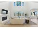 Bright and airy living room with tall ceilings and stylish decor at 9408 Players Canyon Ct, Las Vegas, NV 89144
